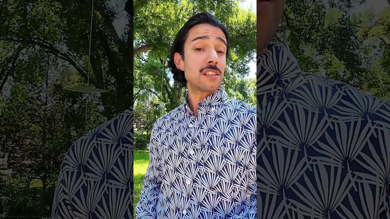 JohnRoss discussing how interior design frees the spirit, standing outdoors in a patterned shirt with trees in the background.