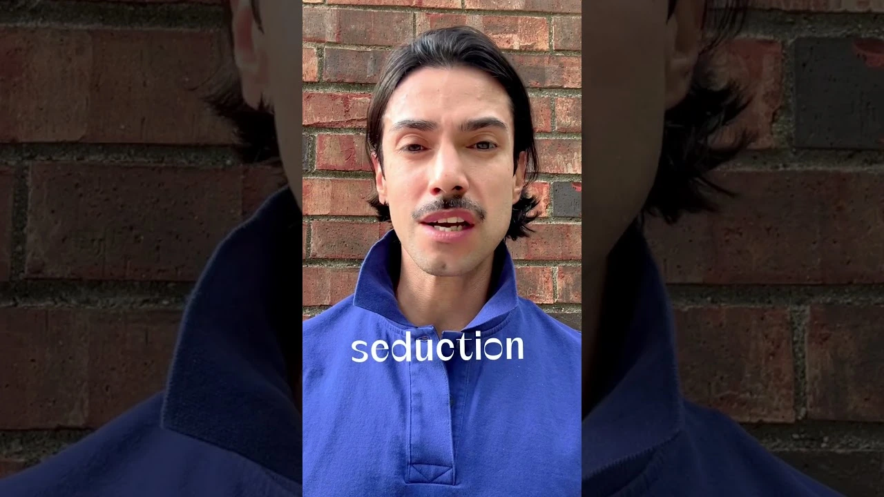JohnRoss in a blue shirt discussing soulful interior design, standing against a brick wall with the word 'seduction' overlaid on screen.
