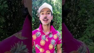 JohnRoss discussing soulful home design in vibrant pineapple shirt surrounded by greenery