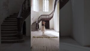 Ballet dancer in aged wooden staircase interior, highlighting patina and natural wear in home design by JohnRoss